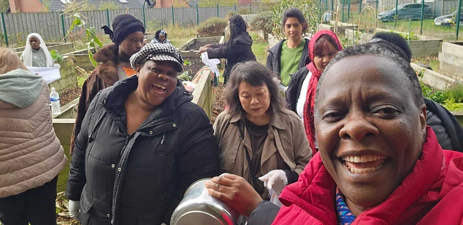 SAWN women learning how to use vegetables they have grown to dye fabric Obutonde Project